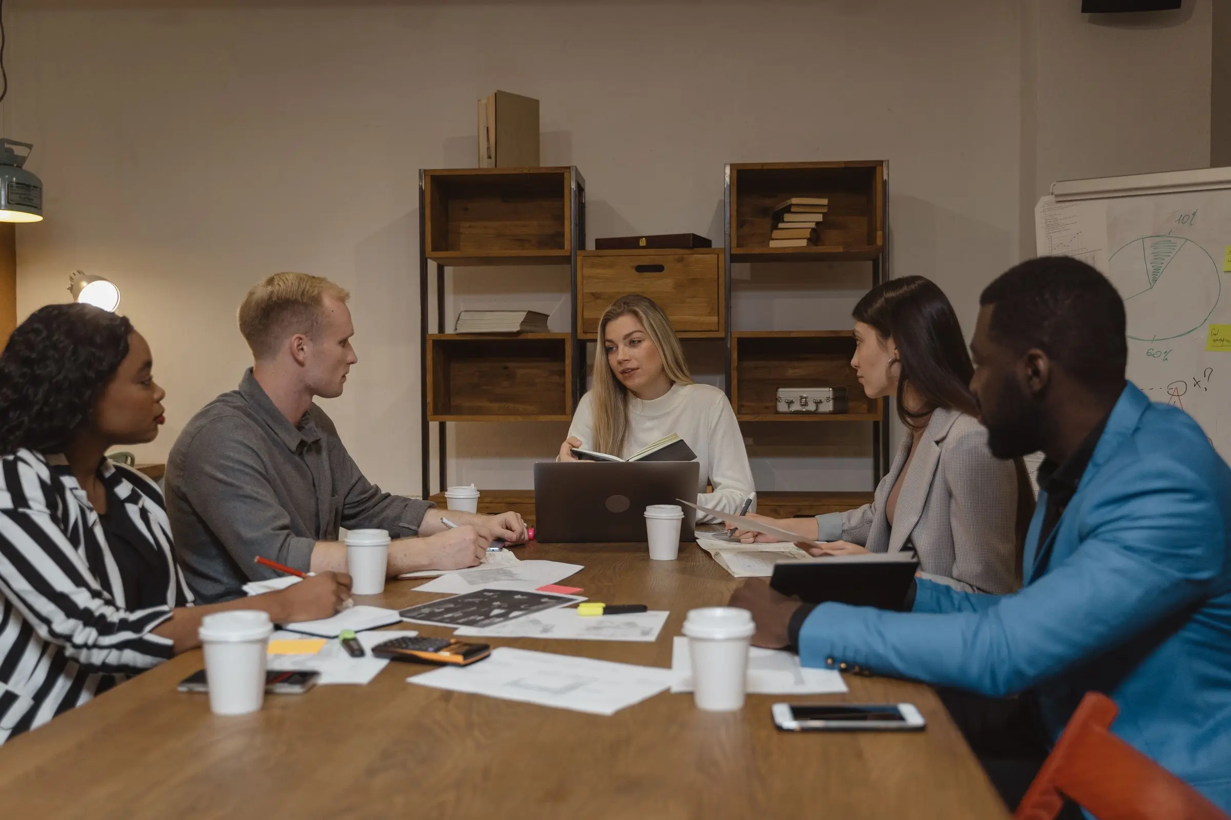 A leadership team meeting around a table