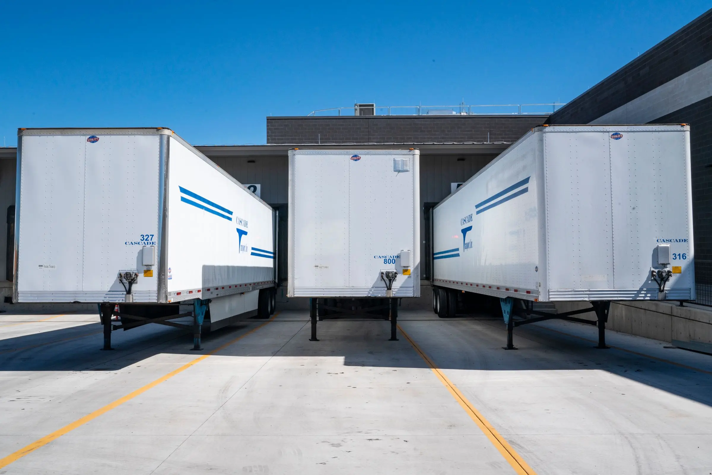 Trailers backed into a distribution center loading dock
